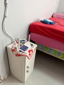 En eller flere senge i et værelse på Casa de praia familiar a 1km do mar