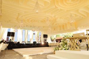 a large room with a large ceiling with flowers on it at Hacienda Lagunillas in Querétaro +88 photos