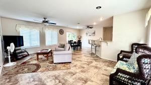 a living room with a couch and a table at 2BR 1BA Blissful Orchard in Keaau