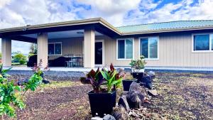 a house with plants in front of it at 2BR 1BA Blissful Orchard in Keaau