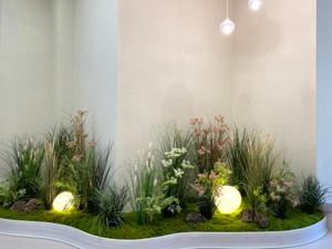 a garden with plants in a room with a wall at Hotel MERV in Seryu-dong