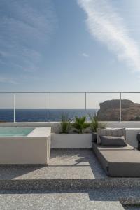 a balcony with a view of the ocean at Lindos 4 me Villa in Lindos