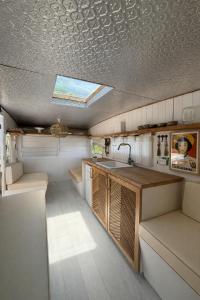 a kitchen with a sink and a skylight on the ceiling at My Island Home Vanuatu in Eton