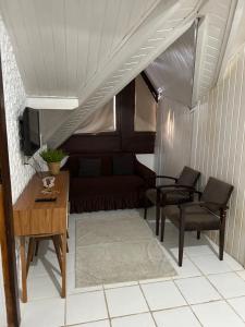 Et tv og/eller underholdning på Duplex em Praia do Forte a 50m da vila