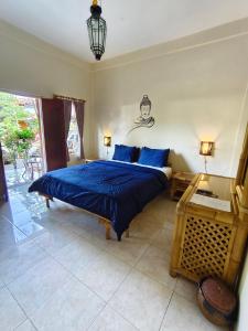 En eller flere senge i et værelse på Hotel Chonos