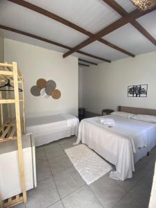 En eller flere senge i et værelse på Residencial Girassol Outeiro