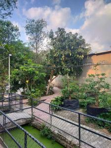 a fence with a bridge over a stream of water at Home Vuon Dua in Ấp Nhứt (1)