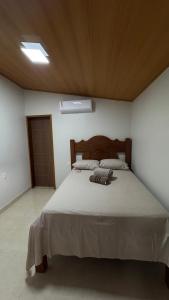 En eller flere senge i et værelse på Casa da Ondina