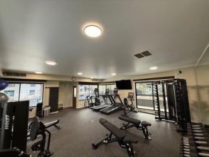 a gym with several treadmills and machines in it at Chateau Roaring Fork 22, Mountain Chic 4-Bedroom Condo on Roaring Fork River – Walk to Downtown Aspen in Aspen