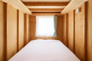 En eller flere senge i et værelse på MOBILITA COURT IWATE