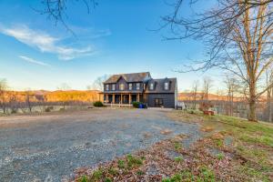 een afbeelding van een groot zwart huis met een oprit bij Hilltop Hideaway - Pool - Jacuzzi - Ping Pong - 12 guests - Fireplace - Mountain Views - Pets are allowed by request in Roseland