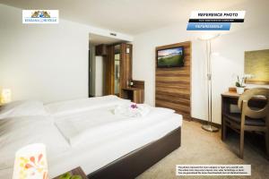 Giường trong phòng chung tại Hotel Enziana Wien