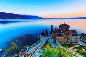 an island in the middle of a large body of water at Spacious Waterfront 3BR - 2Bath & 3 Panoramic Balconies - Pogradec, Lake Ohrid in Pogradec