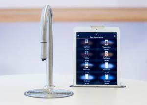 an apple iphone in a kitchen next to a sink at Go Hotel Ansgar in Copenhagen