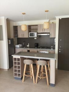 Kuchyň nebo kuchyňský kout v ubytování Vacaciones Playa y Faro La Serena