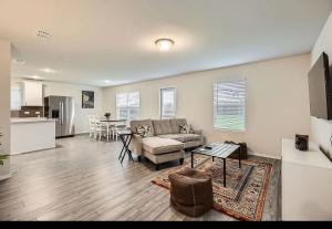 a living room with a couch and a table at Modern Retreat with Private Office in Heath