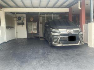 a car is parked in a garage at Roma Guesthouse Terrace With 3 Bedroom & Airconditioning in Shah Alam
