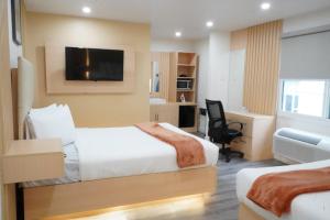 Postel nebo postele na pokoji v ubytování San Francisco Inn