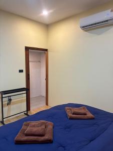 Giường trong phòng chung tại Nuree Bungalow 2 +2 ảnh