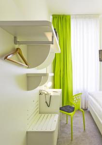 Postel nebo postele na pokoji v ubytování Hotel City Inn Basel