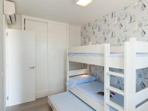 a white bunk bed in a room with white walls at Apartment Las Burras Aquarius09 in San Agustin