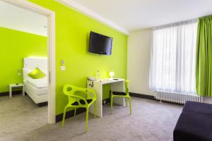 TV a/nebo společenská místnost v ubytování Hotel City Inn Basel