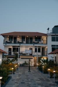 a building with a pathway in front of it at Fenna Resort And Spa, coorg in Kushālnagar
