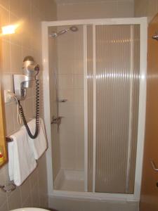 a shower with a glass door in a bathroom at Villa Lipa in Zadar