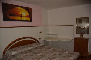 A bed or beds in a room at Casa Gibiseo
