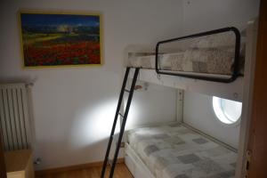 A bed or beds in a room at Casa Gibiseo