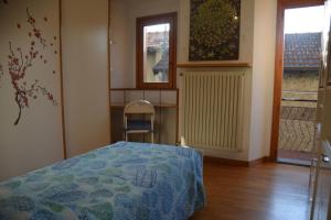 A bed or beds in a room at Casa Gibiseo