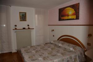A bed or beds in a room at Casa Gibiseo