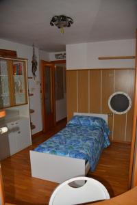 A bed or beds in a room at Casa Gibiseo