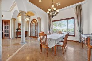 a dining room with a table and chairs at AUTHENTIC SANTA FE STYLE VILLA WITH PANORAMIC VIEWS in Gold Canyon
