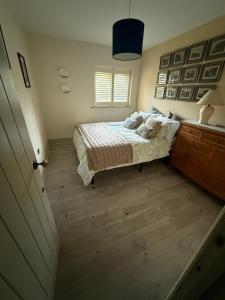 En eller flere senge i et værelse på Elmcroft Holiday Annex