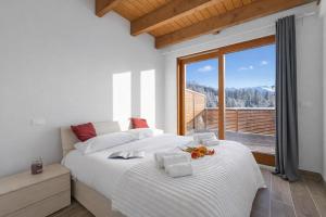 Giường trong phòng chung tại Tana Delle Volpi - Happy Rentals