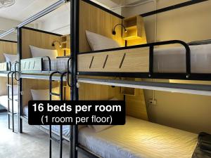 a group of bunk beds in a room at Sunnies 24 in Phra Ae beach