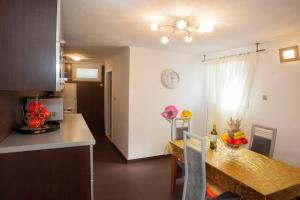 Kuchyň nebo kuchyňský kout v ubytování Apartment Welcome