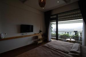 Giường trong phòng chung tại View Home Da Lat +13 ảnh