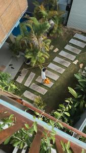 a person sitting on the ground in a garden at Priima in Ahangama +38 photos