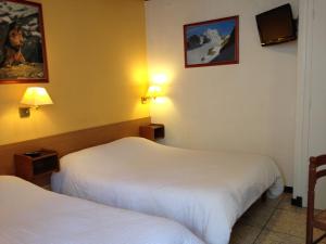 Postel nebo postele na pokoji v ubytování Hotel Sandra