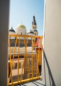 a reflection of a building in a mirror at Friday Hostel in Odesa