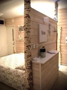 Giường trong phòng chung tại Les remparts