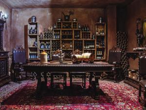 a room with a table with wine bottles on it at Castle de Wildt in Modimolle