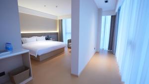 En eller flere senge i et værelse på W Yado Hotel