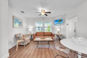 a living room with a couch and a table at The Bungalows in St. Pete Beach