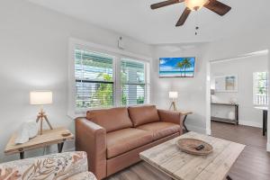 a living room with a couch and a table at The Bungalows in St. Pete Beach