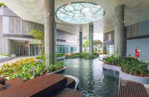a large building with a pool of water in it at HongHome Happy One Central in Ga Phú Văn