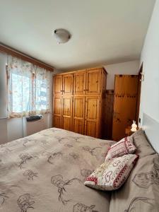 En eller flere senge i et værelse på Rifugio Dei Caprioli