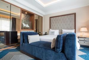 Postel nebo postele na pokoji v ubytování Boutique Hotel La Roche